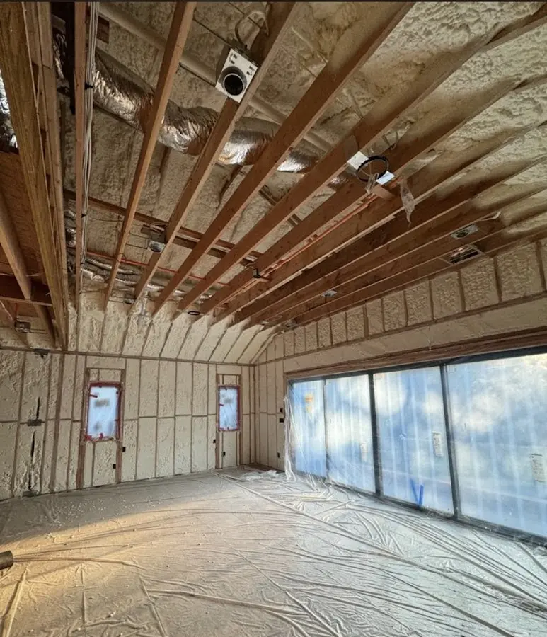 Interior walls and ceiling insulated with spray foam during new construction in Godley